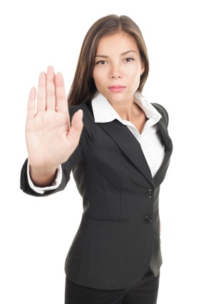 Never (Ever!) Offer a Distressed Seller This… Woman giving hand stop sign